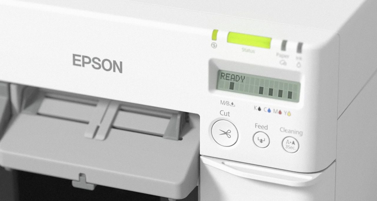 A close up of the epson printer 's controls.